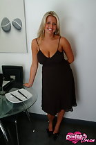 Standing in black dress big breasts
