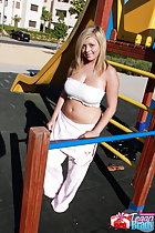 Standing inside playground wearing boob tube