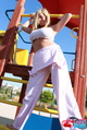 Standing in playground dungarees pulled down