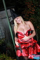 Tegan brady with thumb in dress exposing big breast cleavage blonde hair under witch hat